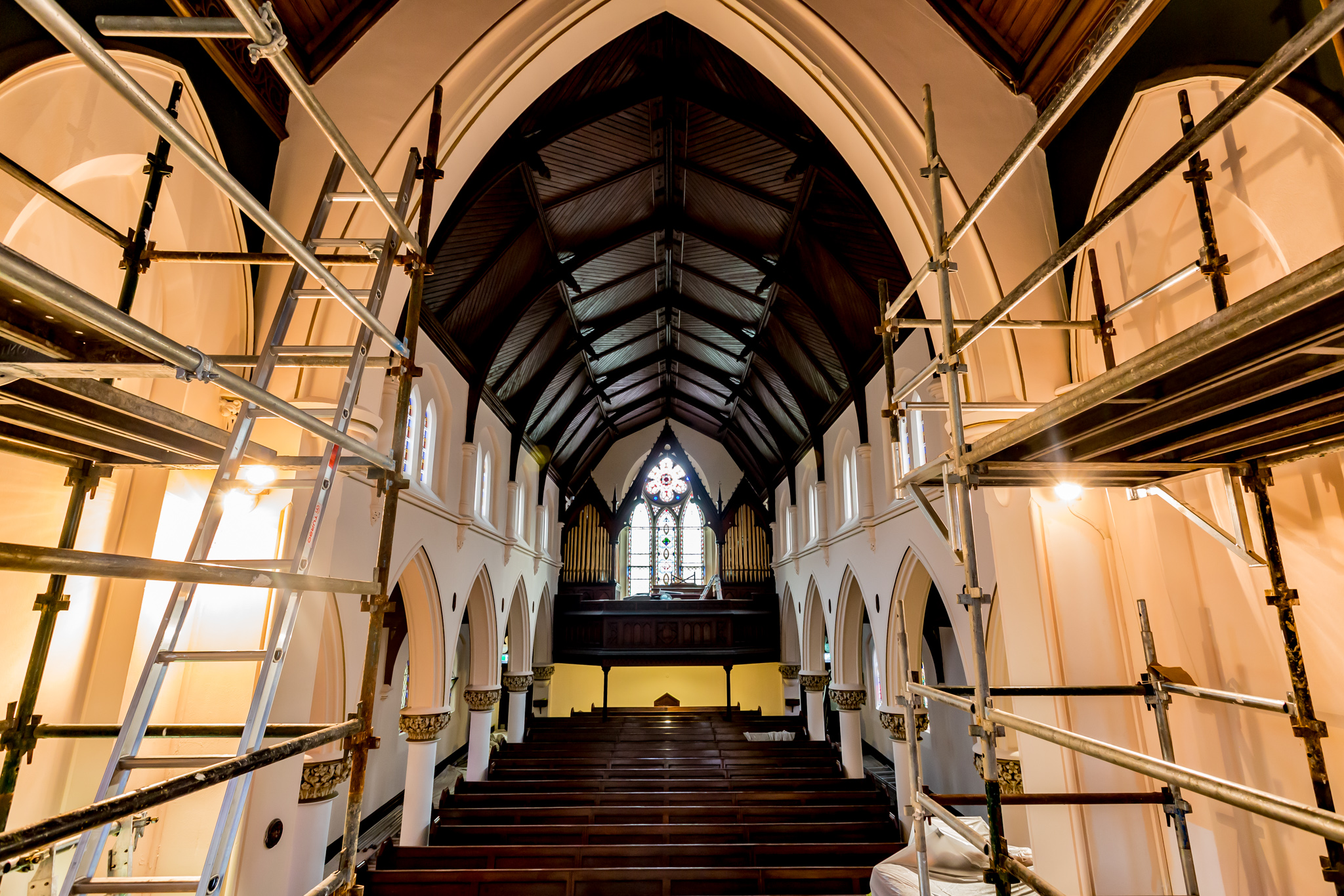 Church interior with scaffold access during coating works