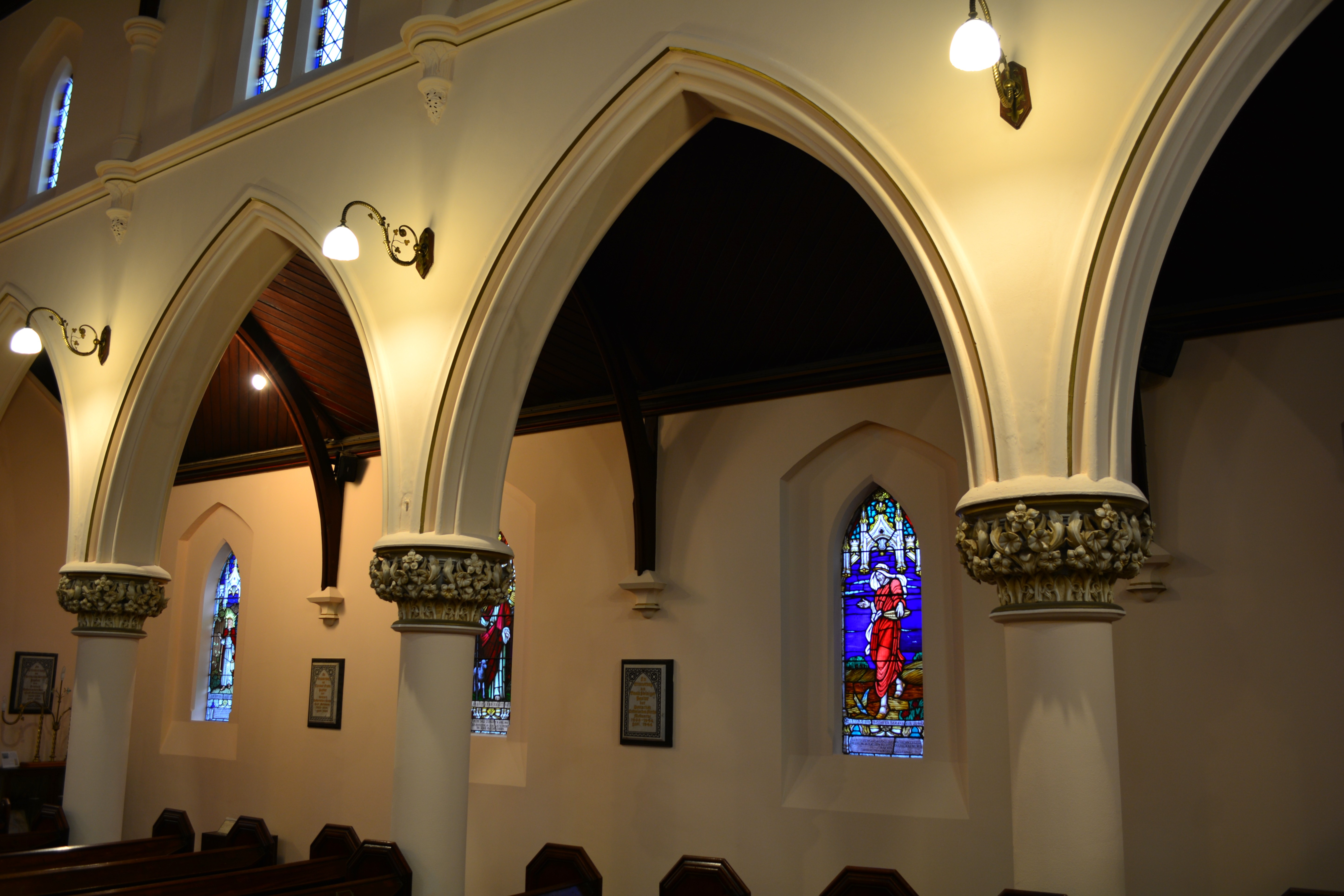 Completed church arches with warm interior lighting after restoration