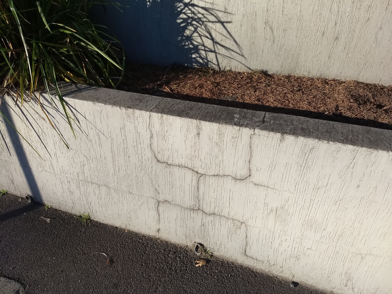 Tired exterior wall area before restoration